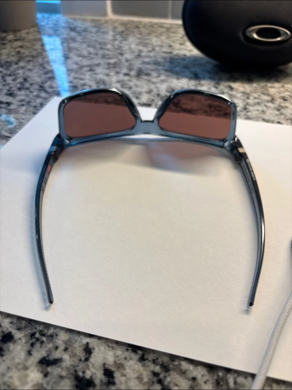 Oakley Sunglasses - Translucent Smoke Frame with Rose Mirror Lenses